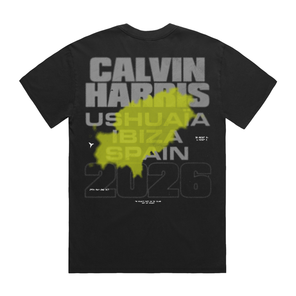 Back of a black T-shirt with “Calvin Harris Ushuaïa Ibiza Spain 2026” text and a green splash graphic printed over the text.