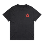 A black short-sleeve crewneck t-shirt with a small red sunburst graphic printed on the left chest, displayed flat against a solid white background.
