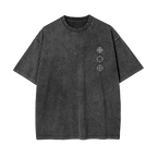A dark gray mineral-wash short-sleeve t-shirt with a small white geometric target graphic printed on the left chest, displayed against a solid white background.